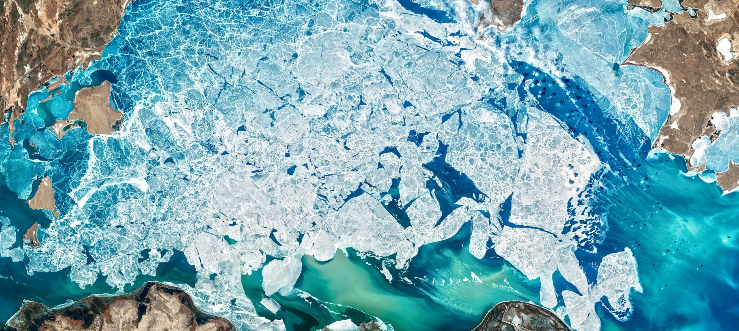 Nature image showing ice and water from above