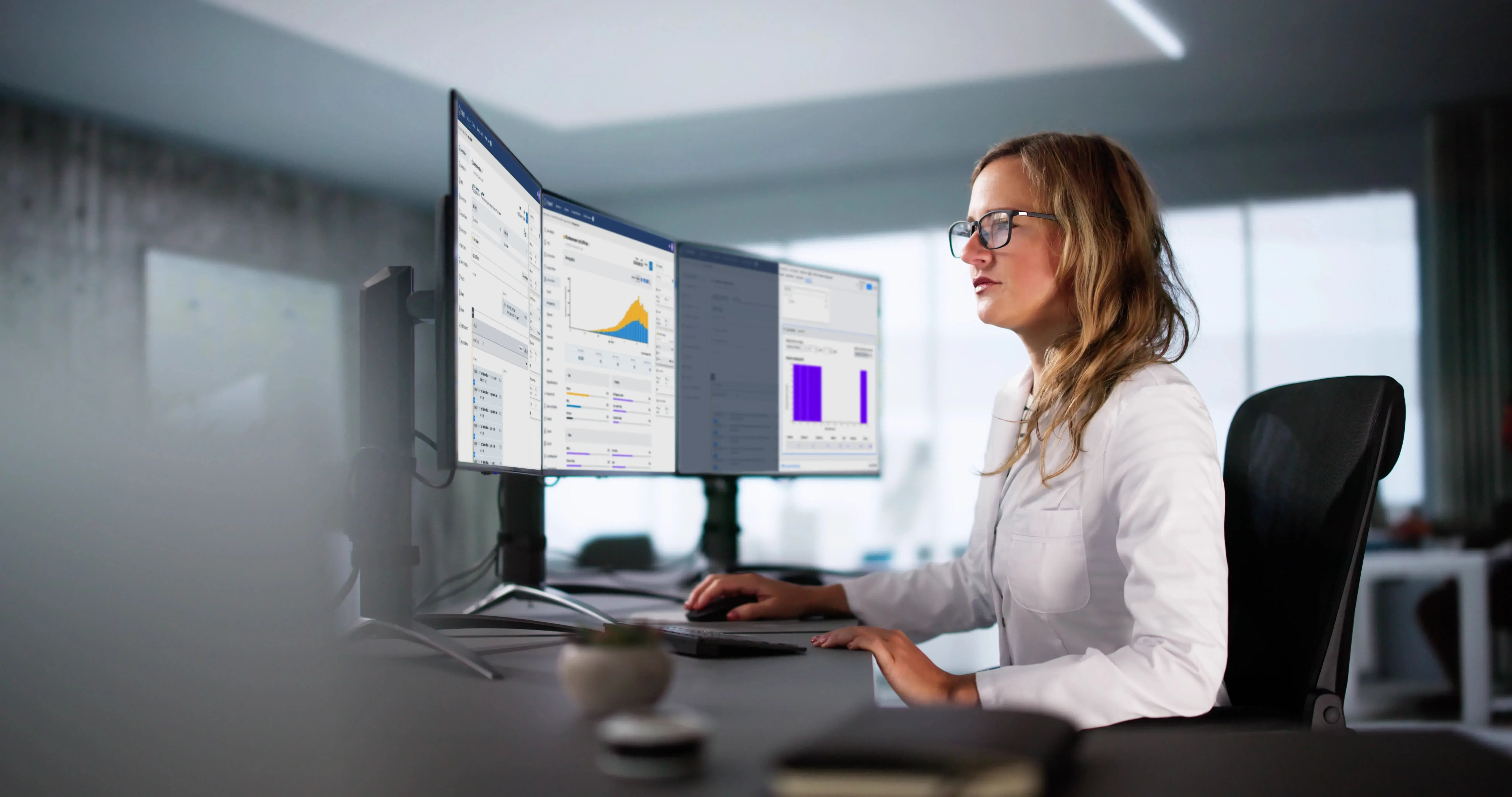 Lady working in office looking at data